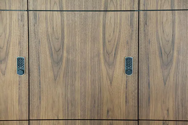 Tech-integrated custom closet with a hidden safe panel and smart lock feature in Northern VA