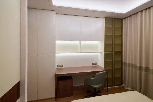 Custom built-in home office with floor-to-ceiling cabinetry, integrated desk, and LED lighting in a McLean VA home