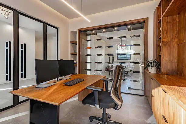 Custom built-in home office with organized cabinetry, clean desk surface, and hidden cable management in an Arlington VA home