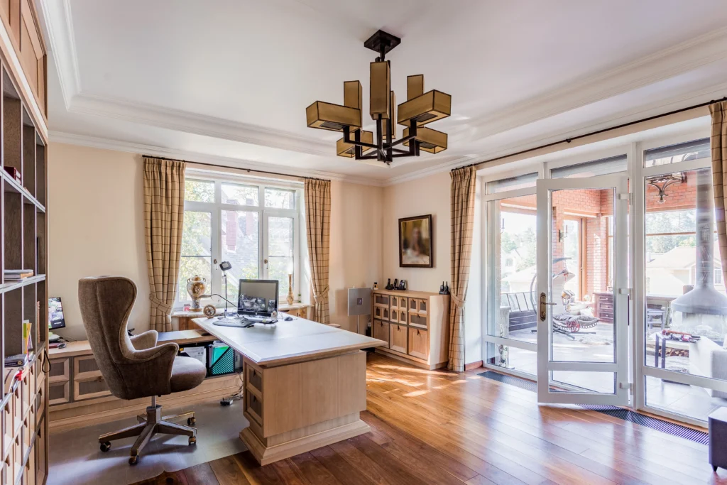 Custom built-in home office Northern VA comparison showing floor-to-ceiling cabinetry and integrated desk versus standard freestanding furniture in a Bethesda home