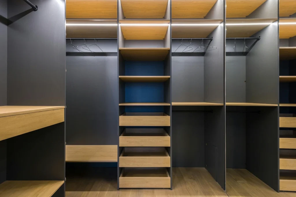 custom closet with integrated LED strip lighting and shoe display