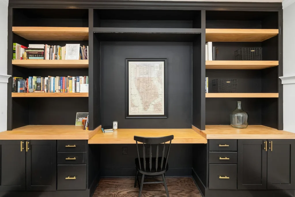 built-in home office desk with soft close drawers and display shelving