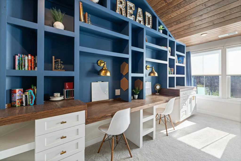 home office nook with custom built-in desk and overhead cabinet storage