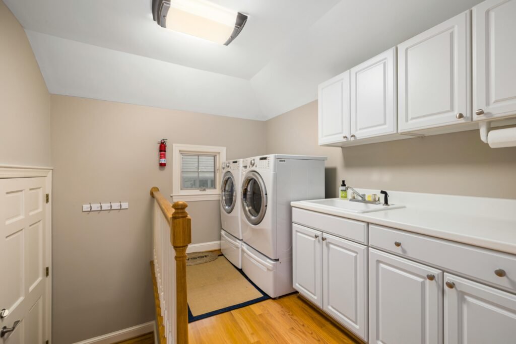mudroom and laundry room combination with custom built-in storage