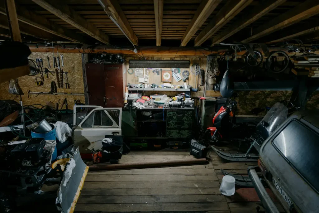 cluttered garage transformed with custom wall cabinets and slatwall storage