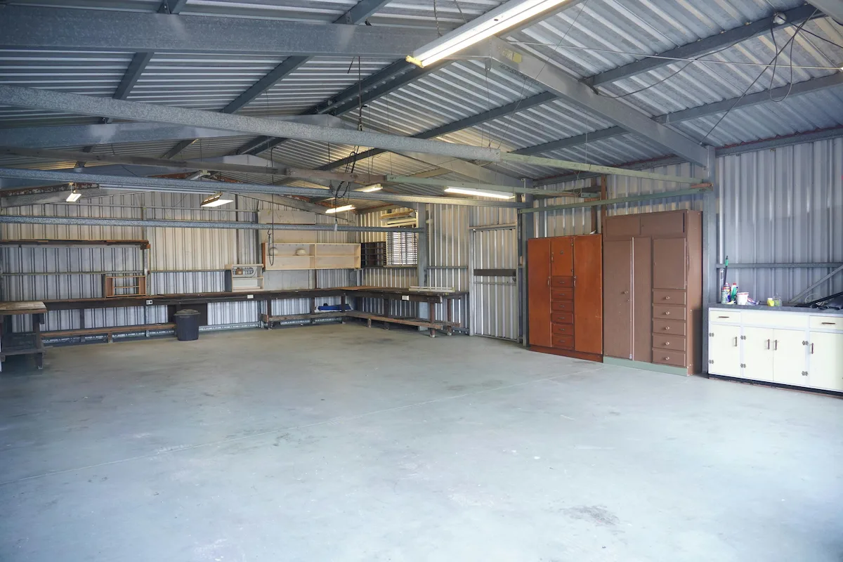premium garage storage system with floor to ceiling cabinets and workbench