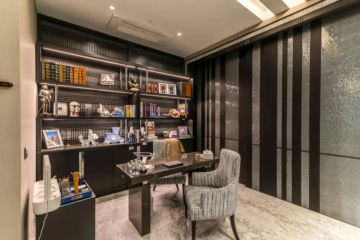 premium home office with built-in desk wall and floor to ceiling shelving